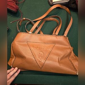Brown guess tote pursue